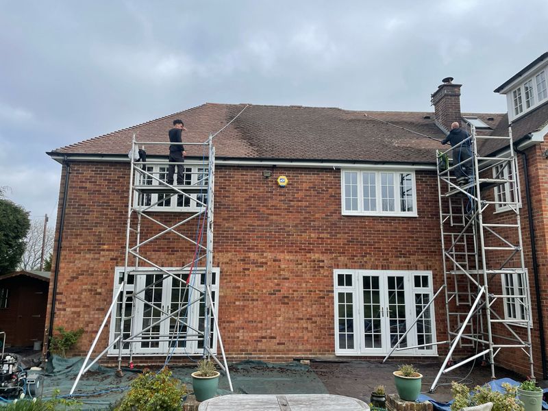 Roof cleaning carried out safely from scaffold towers by The Roof Moss Cleaners in Farnborough
